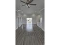 Bright and open living room with modern flooring and sliding glass doors to a deck at 326 46Th Ave. N, North Myrtle Beach, SC 29582