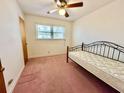 Cozy bedroom with a metal-frame bed, light walls, and a bright window at 57 Tallahassee Rd., Georgetown, SC 29440