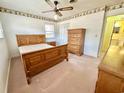 Bedroom with wood furniture set and a window providing natural light at 57 Tallahassee Rd., Georgetown, SC 29440