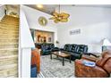Inviting living room with high ceilings, ceiling fan, and comfortable leather seating at 6095 Catalina Dr. # 1614, North Myrtle Beach, SC 29582