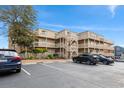 Exterior of a condominium complex with multiple balconies and exterior stairs and landscaping at 9661 Shore Dr. # A-21, Myrtle Beach, SC 29572