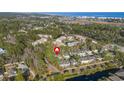 Aerial view of a coastal community with homes, pools, and lush landscaping near the ocean at 98 Wallys Way # 1, Pawleys Island, SC 29585