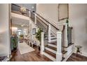 Elegant foyer with a grand staircase, hardwood floors, and open view to the living area at 1006 James Island Ave., North Myrtle Beach, SC 29582