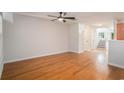 Spacious living room with hardwood floors and natural light, with stairs leading to upper level at 1024 Stanton Pl. # 1024, Myrtle Beach, SC 29579