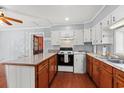 Cozy kitchen with wooden cabinets, countertops, and hardwood flooring, providing a warm, inviting space at 1861 Jenerette Rd, Mullins, SC 29574