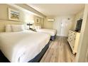 This room showcases two beds, attractive decor and lots of light at 201 S Ocean Blvd. # 717, Myrtle Beach, SC 29577