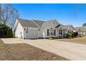 Single Gathering home featuring an attached garage and a concrete driveway at 2029 Hawksmoor Dr., Conway, SC 29526