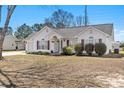 Charming single-story home with a well-manicured lawn and a welcoming entrance with an american flag at 2029 Hawksmoor Dr., Conway, SC 29526