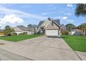 Beautiful home with a long driveway, two-car garage, and green lawn at 2668 Corn Pile Rd., Myrtle Beach, SC 29588