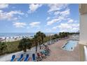 Relaxing view of the pool, beach and ocean beyond from an elevated point of view at 2701 S Ocean Blvd. # 202, North Myrtle Beach, SC 29582
