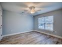 Well-lit bedroom with wood-look tile flooring and a ceiling fan for added comfort at 2705 Mercer Dr. # 2705, Conway, SC 29526