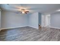 Spacious living room with neutral paint, stylish flooring, ceiling fan and staircase at 2709 Mercer Dr. # 2709, Conway, SC 29526