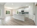 Bright kitchen featuring white cabinets, stainless appliances, and a large island at 3317 Little Bay Dr., Conway, SC 29526