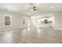 Open living space with a ceiling fan and large windows at 3317 Little Bay Dr., Conway, SC 29526