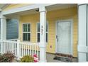 Inviting front porch with white columns and a view of the home's exterior with address number at 337 Sailors Ct., Myrtle Beach, SC 29577