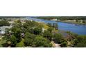 Scenic aerial shot of waterfront homes surrounded by lush greenery and a waterway at 4430 Eastport Blvd. # L9, Little River, SC 29566