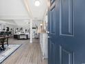 Welcoming entryway with wood flooring, decorative cabinet, and a glimpse into the living spaces at 509 Hillsborough Dr., Conway, SC 29526