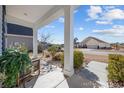 Inviting front porch featuring decorative plants, a welcome mat, and attractive landscaping at 509 Hillsborough Dr., Conway, SC 29526
