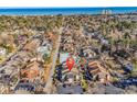 Breathtaking aerial view highlighting the community's proximity to the ocean and tennis courts in a desirable location at 617 14Th Ave. S # 83, Surfside Beach, SC 29575