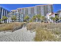 Beautiful oceanfront resort with multiple balconies accessible via sandy beach walkway and boardwalk at 7200 Ocean Blvd. N # 1059, Myrtle Beach, SC 29572