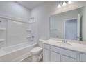 Clean bathroom with a shower-tub combo and a vanity with a large mirror at 108 Wagner Cir., Conway, SC 29526