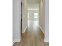 Bright hallway with wood-style floors leading to the living area at 108 Wagner Cir., Conway, SC 29526