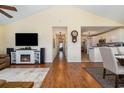 Spacious living room featuring an electric fireplace, hardwood floors, and an open floor plan to the kitchen at 115 Blue Pride Dr., Loris, SC 29569