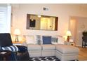 Comfortable living room featuring a plush sectional sofa, hardwood floors and stylish decor at 140 Spanish Oak Ct. # 1, Surfside Beach, SC 29575