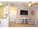 Bright living room with modern decor, wood-look flooring, and ceiling fan at 140 Spanish Oak Ct. # 1, Surfside Beach, SC 29575