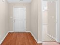 Inviting foyer featuring gleaming hardwood floors and a clear view into the home's spacious interior at 1580 Circle Bay Dr., Longs, SC 29568