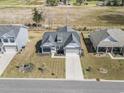 Aerial view of a single Gathering home with a two car garage and well-manicured front lawn at 179 Crabapple Dr., Longs, SC 29568