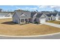 Charming single-story home with a two-car garage on a well-manicured corner lot at 252 Lakota Loop, Longs, SC 29568