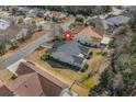 An aerial view of the back of a single-Gathering home with a deck and well-maintained lawn at 2911 Winding River Dr., North Myrtle Beach, SC 29582