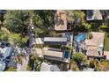 An aerial view of the property showcasing the home, pool, driveway, and surrounding landscaping at 316B Lakeside Dr., Surfside Beach, SC 29575