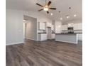 Open-concept living space with sleek floors, a ceiling fan, recessed lighting, and seamless kitchen access at 415 Lifestyle Court, Surfside Beach, SC 29575