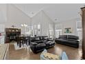 Cozy living room with hardwood floors, leather sofas, and large windows providing ample natural light at 800 Lorenzo Dr., North Myrtle Beach, SC 29582