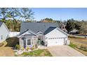 Beautiful single-Gathering home boasting a stone facade, attached garage, and manicured landscaping in front yard at 804 Twickenham Loop, Longs, SC 29568