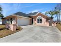 Charming single-story home featuring a well-manicured lawn and a private driveway at 9827 Simonton Ct., Murrells Inlet, SC 29576