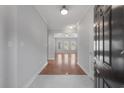 Open entryway with hardwood floors leading to a light-filled living area at 1019 Hillsdale Dr., Little River, SC 29566
