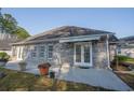 The back of the home features a brick exterior and a covered patio area at 1019 Hillsdale Dr., Little River, SC 29566