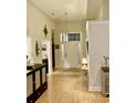 Bright foyer with hardwood floors, decorative lighting, and stylish accents creating a welcoming entrance at 1501 Landfall Dr., North Myrtle Beach, SC 29582