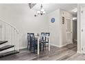 Dining room area features a table with four chairs, decor and a nautical theme at 1880 Auburn Ln. # 24E, Surfside Beach, SC 29575