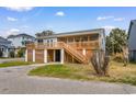 Charming beach house with a large deck and easy access to outdoor space at 406 47Th Ave. S, North Myrtle Beach, SC 29582