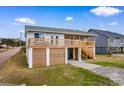 Quaint beach house with large deck, perfect for outdoor living and entertaining at 406 47Th Ave. S, North Myrtle Beach, SC 29582