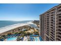Breathtaking aerial view of the beachfront property with pools, ocean views, and well-manicured grounds at 100 N Beach Blvd. # 1608, North Myrtle Beach, SC 29582