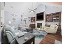 Spacious living room with a fireplace, built-in shelving, comfortable seating, and an open layout at 120 Swallowtail Ct., Little River, SC 29566