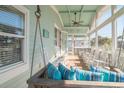 Inviting screened porch with comfortable seating, perfect for relaxing and enjoying the outdoors at 162 Norris Dr., Pawleys Island, SC 29585