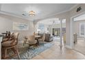 Charming dining area with a round table and seating for four, complemented by an open-concept living space at 2180 Waterview Dr. # 713, North Myrtle Beach, SC 29582