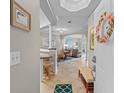 Inviting entryway showcasing an open-concept layout with tile flooring and neutral tones leading to a dining and living area at 2180 Waterview Dr. # 713, North Myrtle Beach, SC 29582