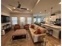 Open concept living area with modern finishes, recessed lighting, and plenty of windows at 2441 Capri Court, Conway, SC 29527